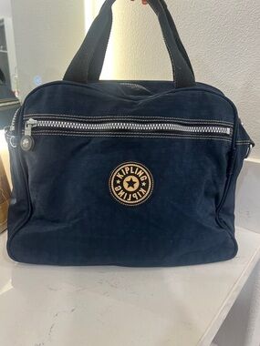 Kipling Navy Duffel Bag with Front Zip Pocket. Beautiful bag. Missing strap